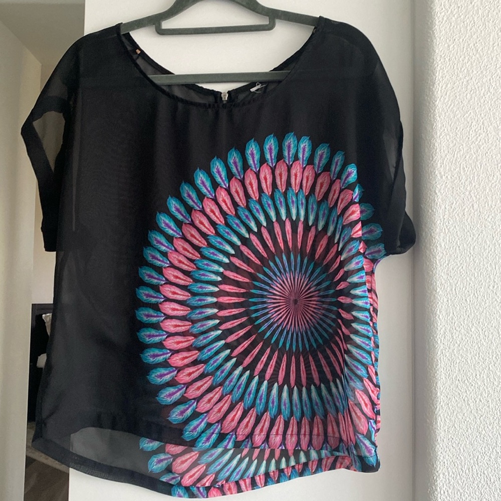 Sheer top with feather design